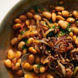 Rosemary white beans with frizzled onions and tomato